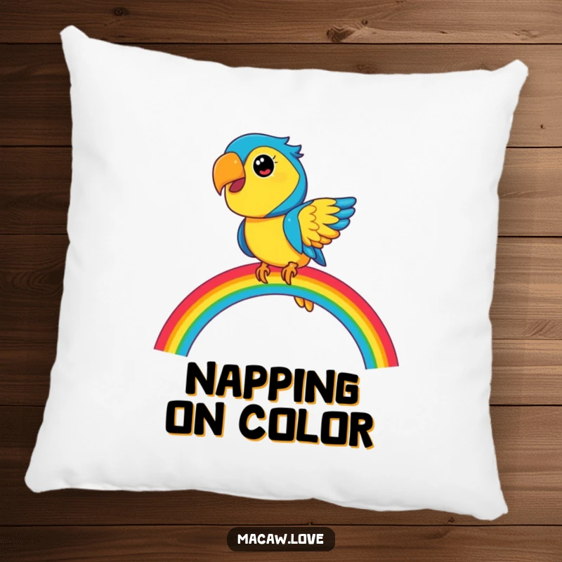 Funny blue and yellow macaw character balancing on a vibrant rainbow, depicted on a soft pillow for ultimate comfort and decor.