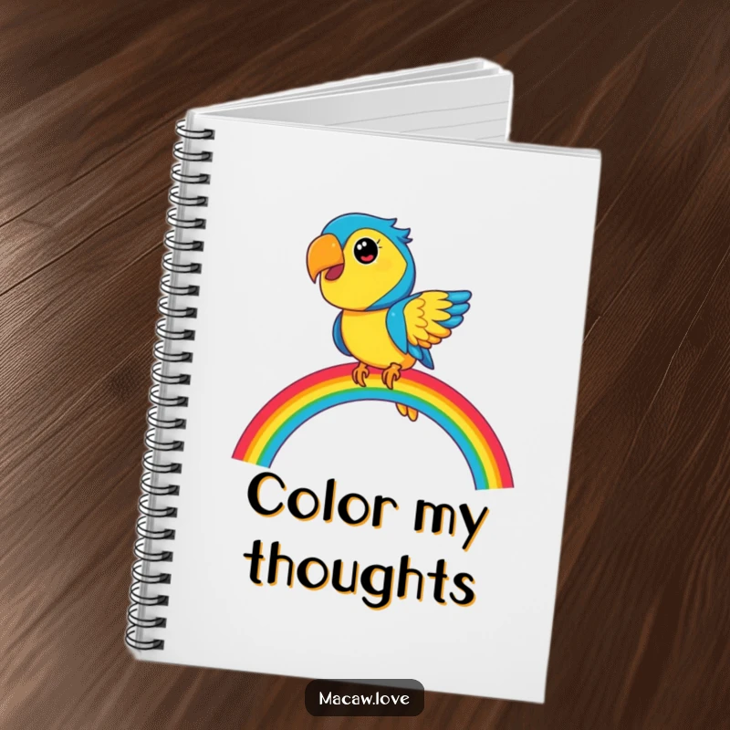 Funny blue and yellow macaw character balancing on a vibrant rainbow, featured on a notebook for creative writing and planning.
